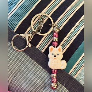 Adorable handmade husky beaded keychain .